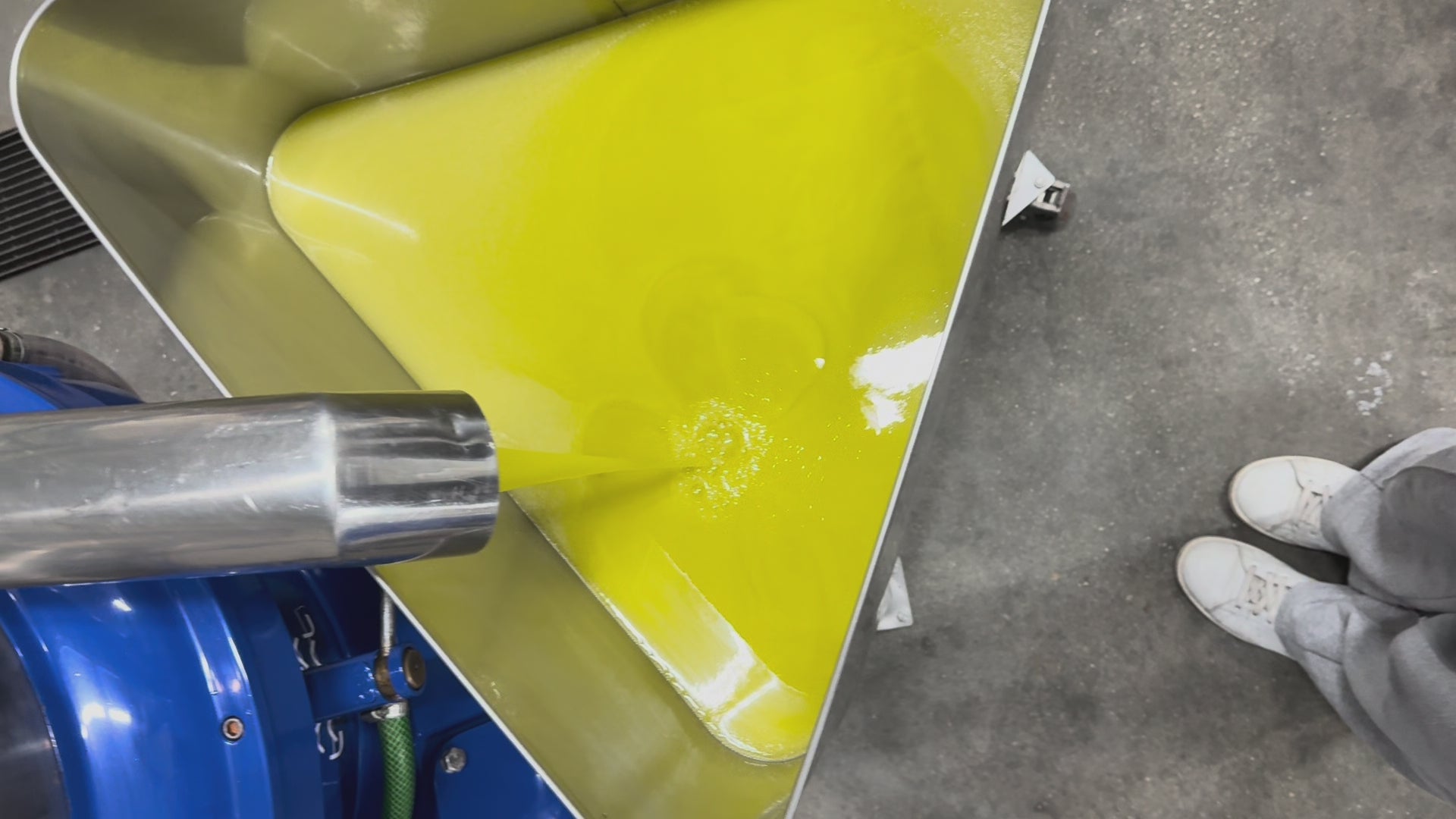 Load video: birds eye view of near-luminescent green extra virgin olive oil being cold extracted in a sicilian oleificio by oro sicani